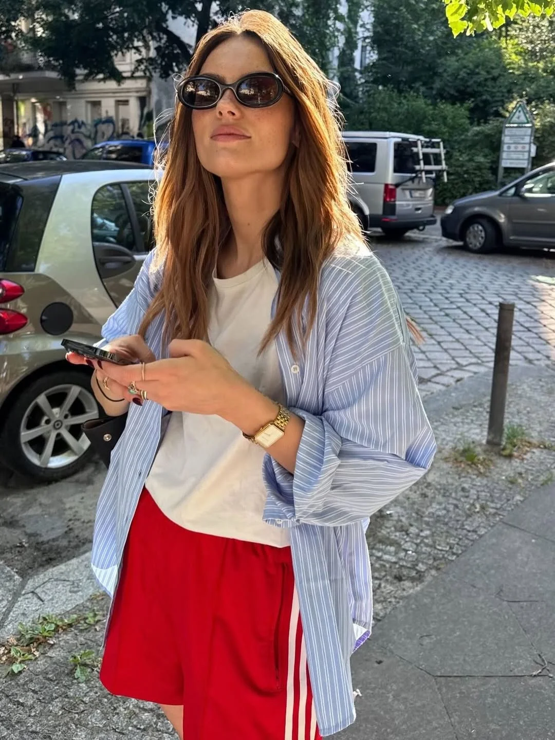 early summer outfits 2026 Sporty Red Shorts Meet Classic European Street Style