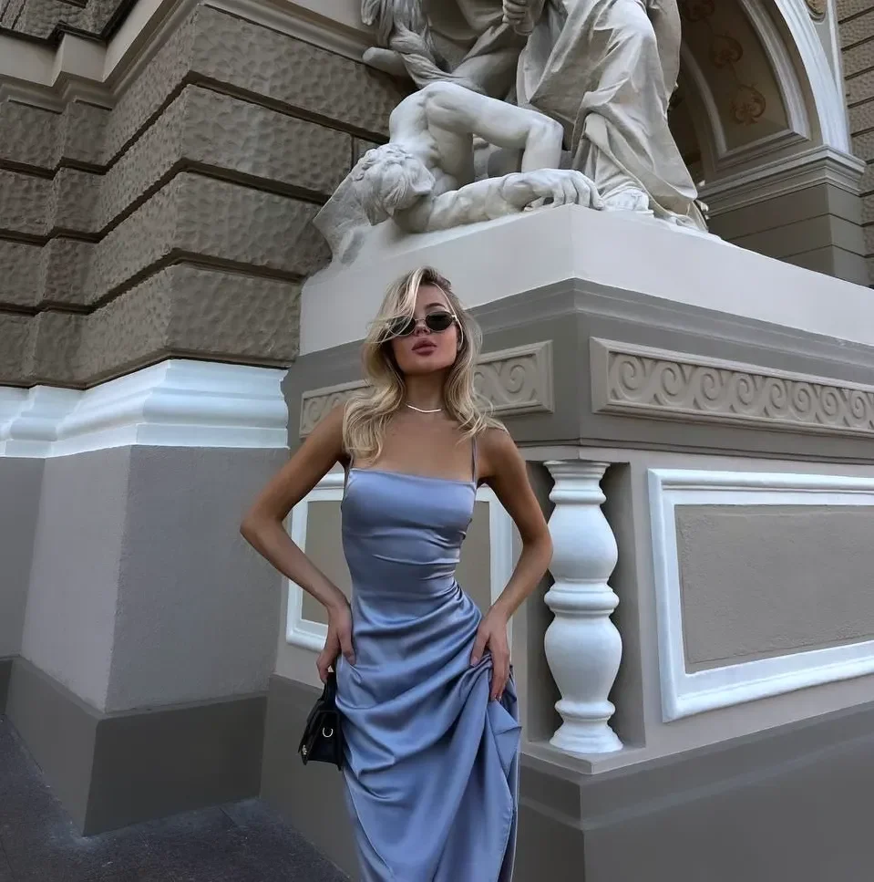 early summer outfits 2026 Silky Blue Satin Dresses Bring Quiet Luxury Into Early Summer