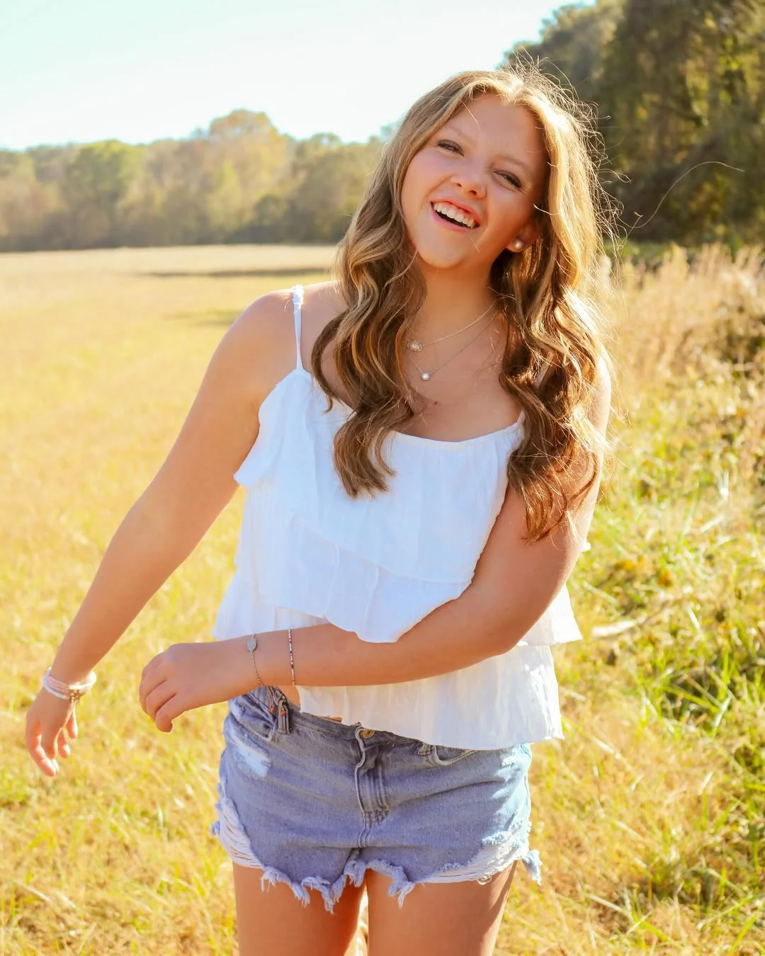 early summer outfits 2026 White Ruffle Tops and Denim Shorts Capture the Spirit of Summer