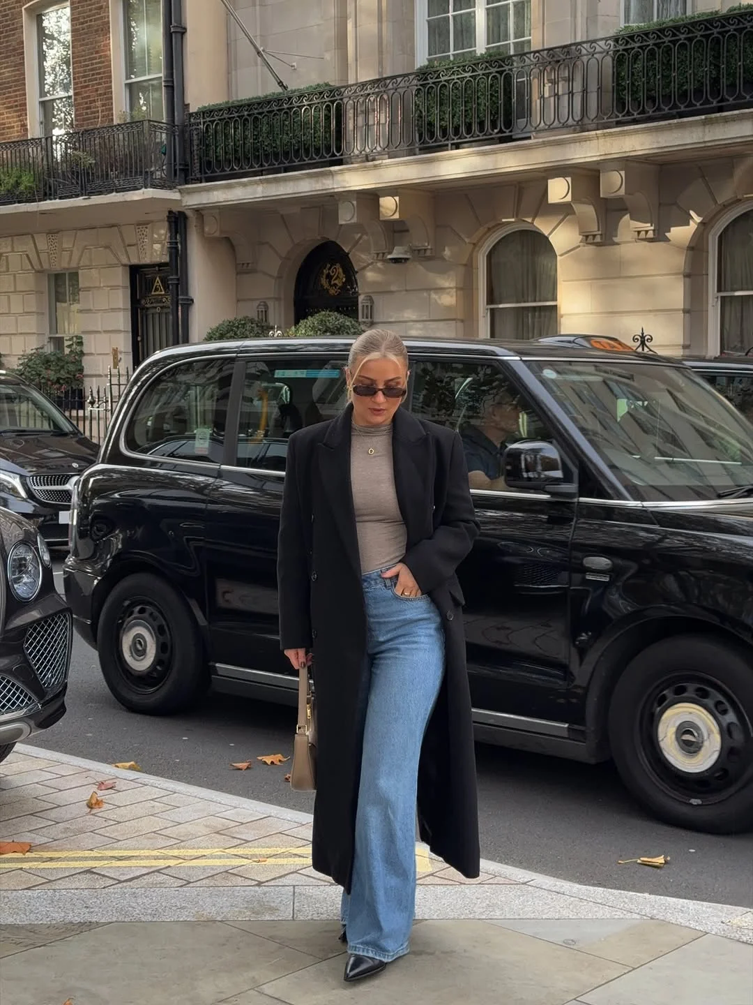 fall outfits with coat 2026 Black Coats and Blue Jeans Are Still the Chicest Combination