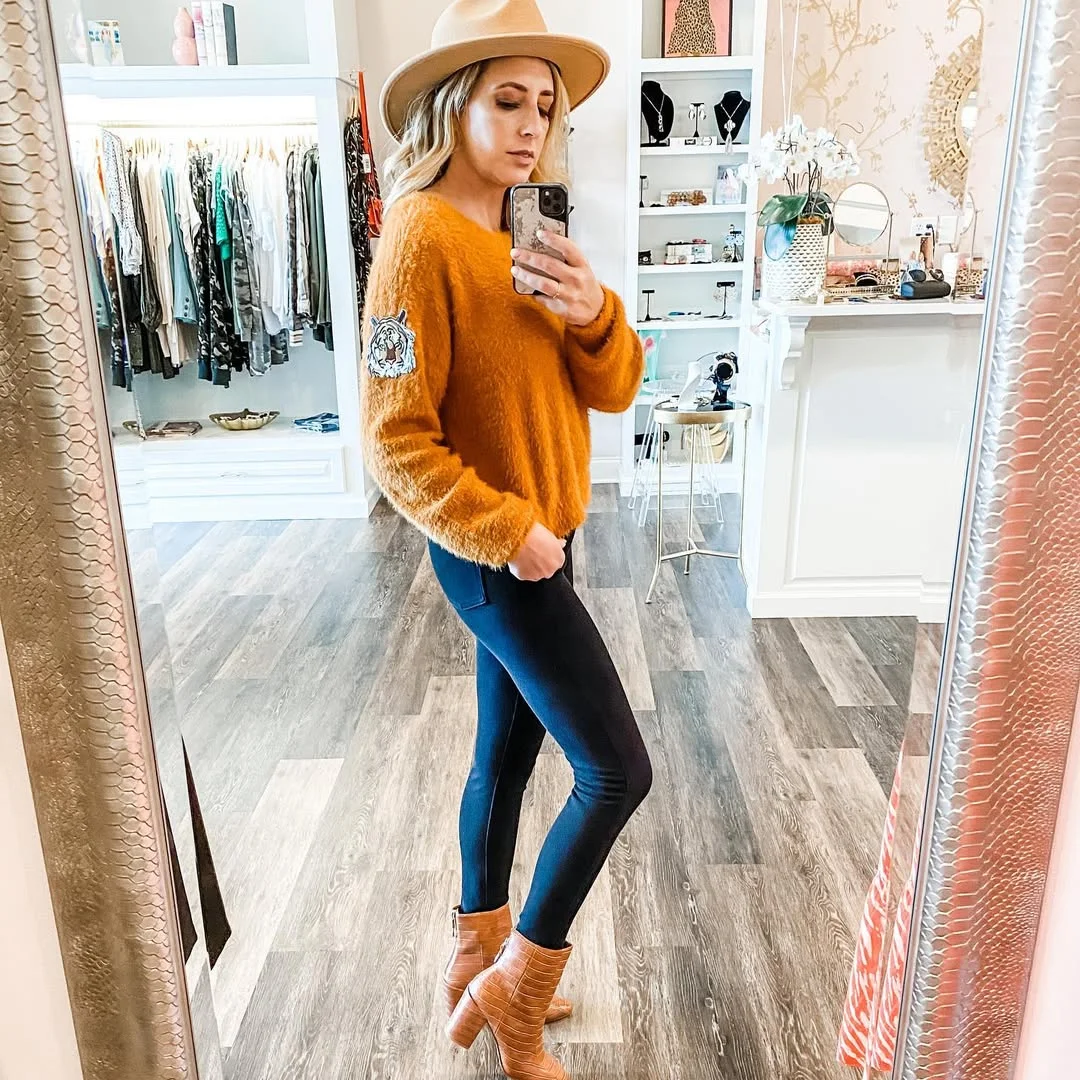fall outfits with leggings and boots 2026 Western Inspired Sweater and Brown Ankle Boots