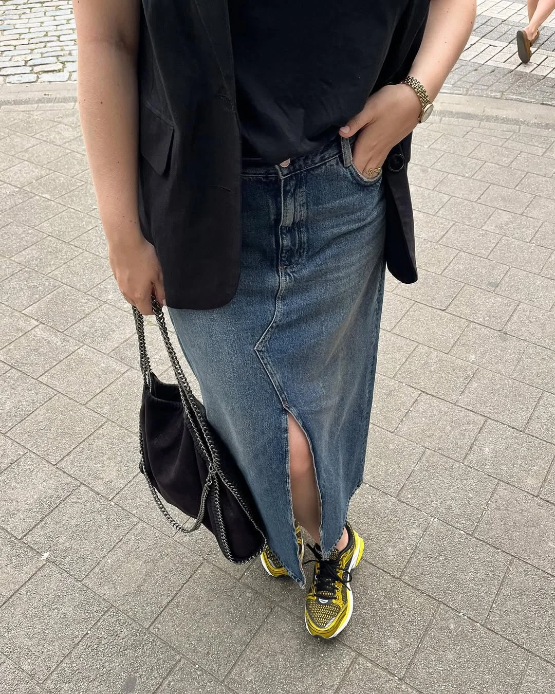 fall outfits with sneakers and jeans 2026 The Denim Midi Skirt and Sneakers Pairing That Feels Unexpectedly Modern