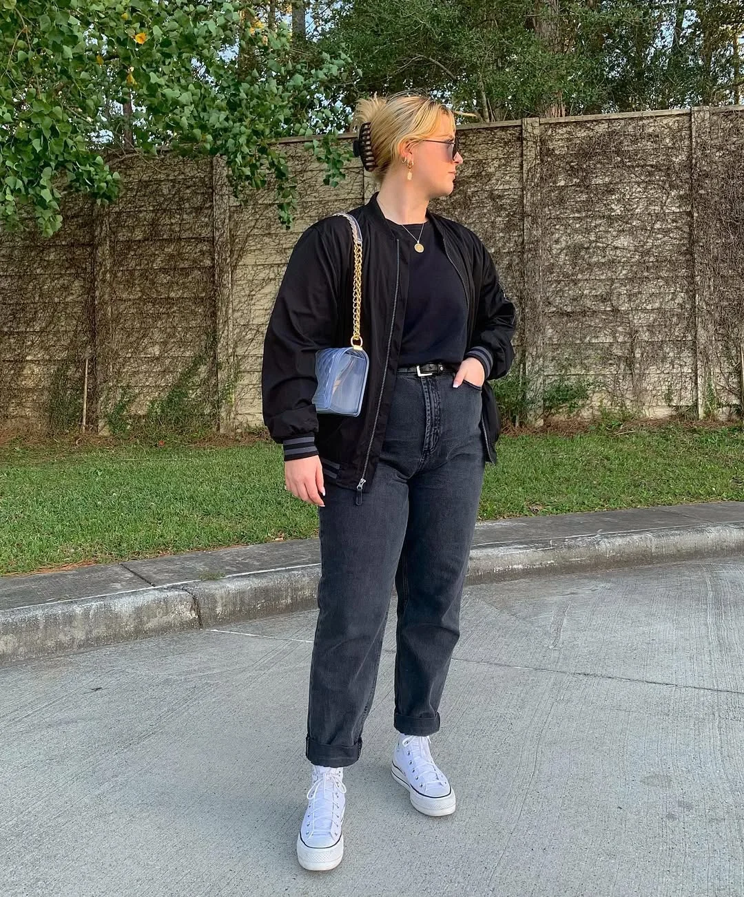 fall outfits with sneakers and jeans 2026 An All-Black Base with White High-Tops Never Misses