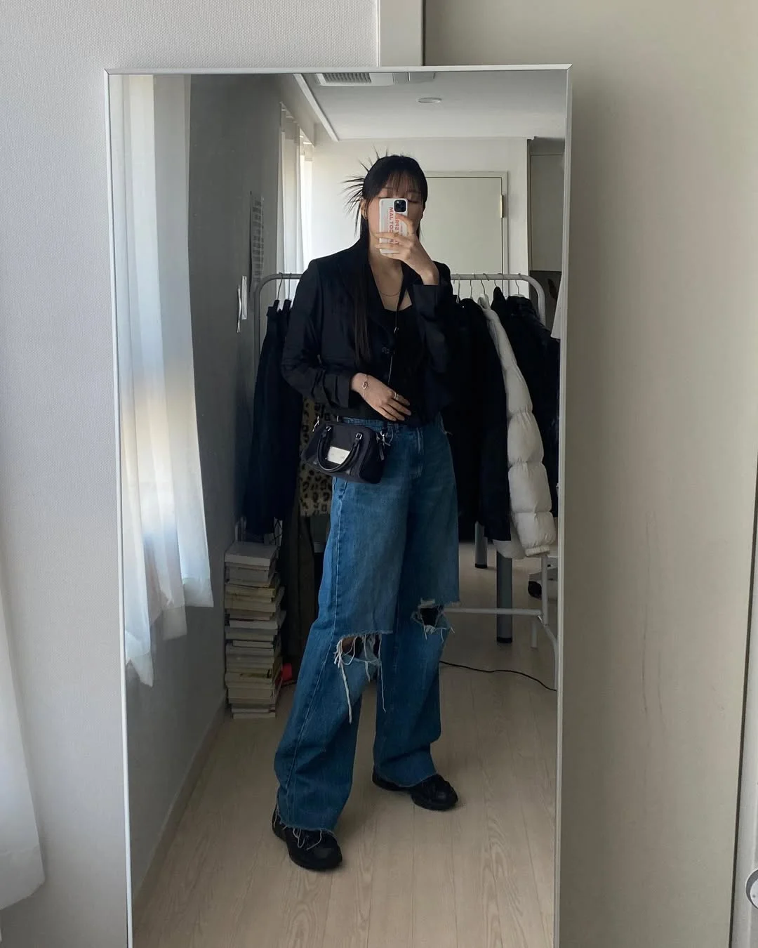 fall outfits with sneakers and jeans 2026 Relaxed Black Layers Meet Wide-Leg Denim