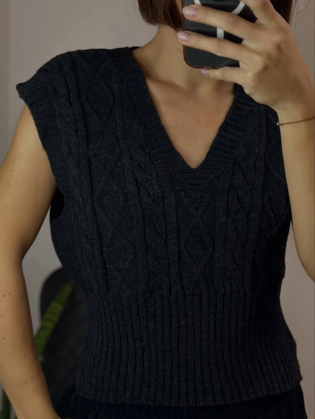fall outfits with vests 2026 The Black Knitted Vest Every Wardrobe Needs