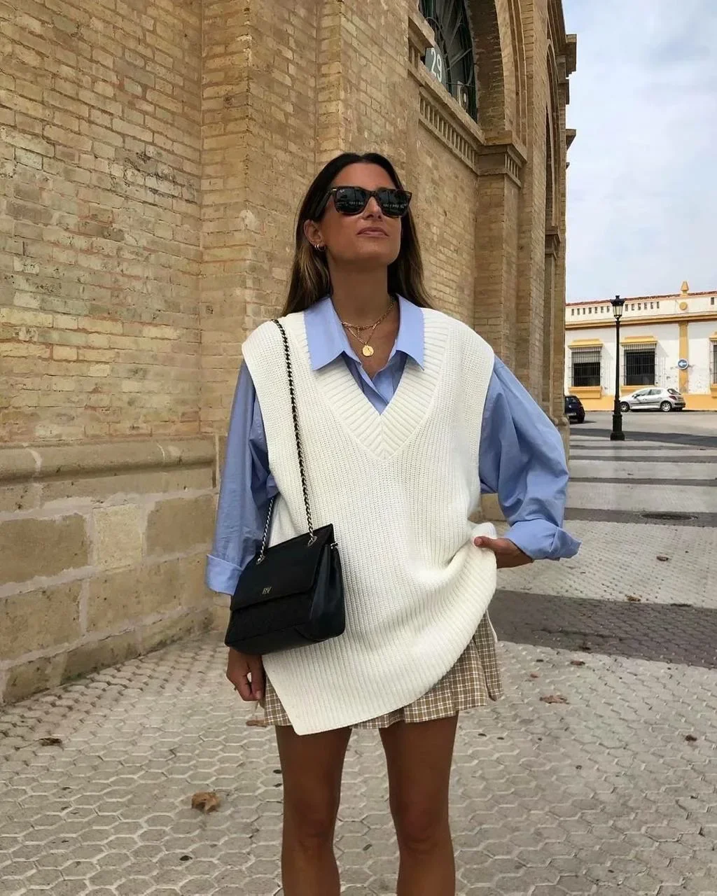fall outfits with vests 2026 The White Sweater Vest and Mini Skirt Formula Everyone Loves