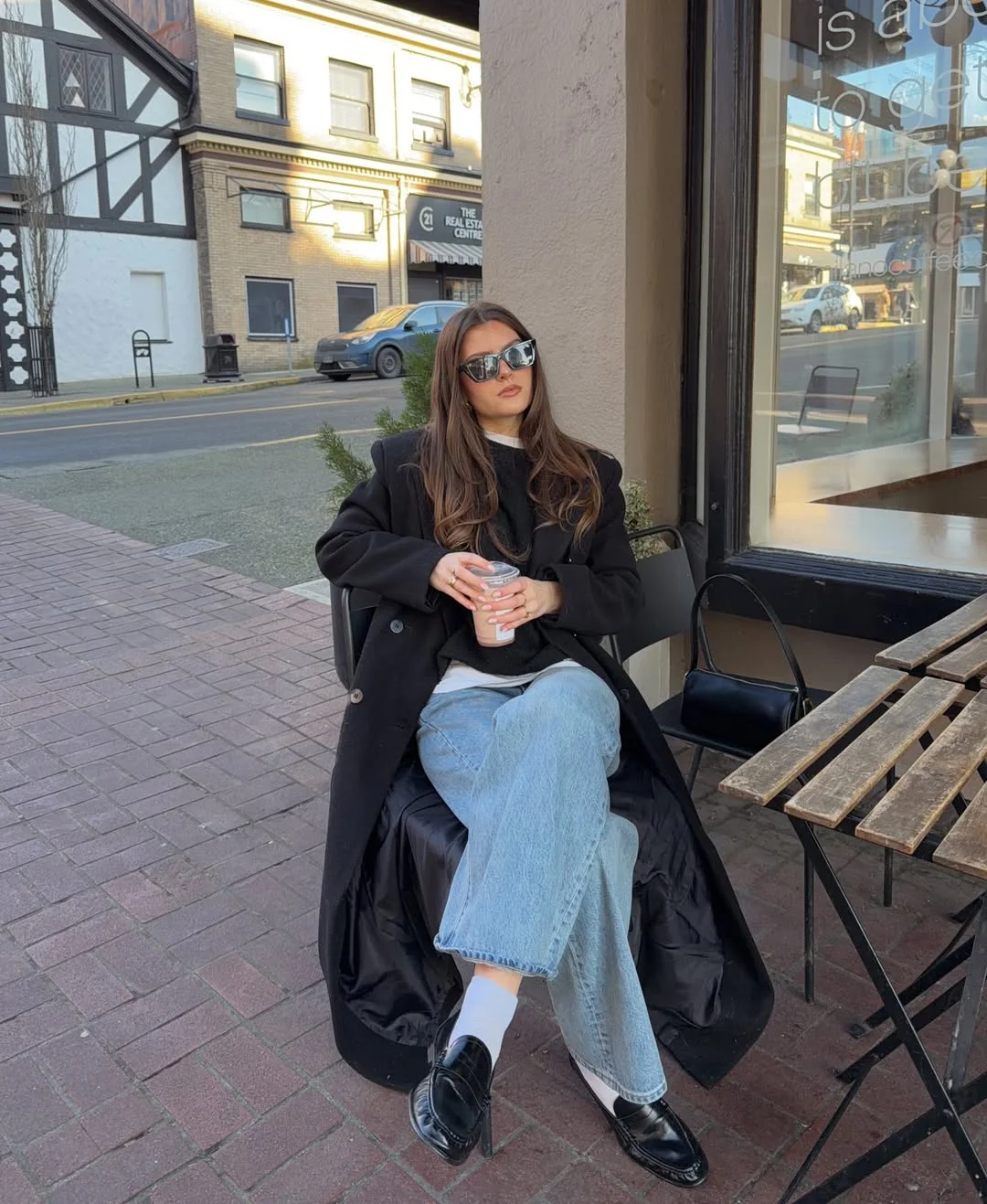 fall street fashion nyc 2026 Oversized Black Coats and Coffee-Shop Layering Energy
