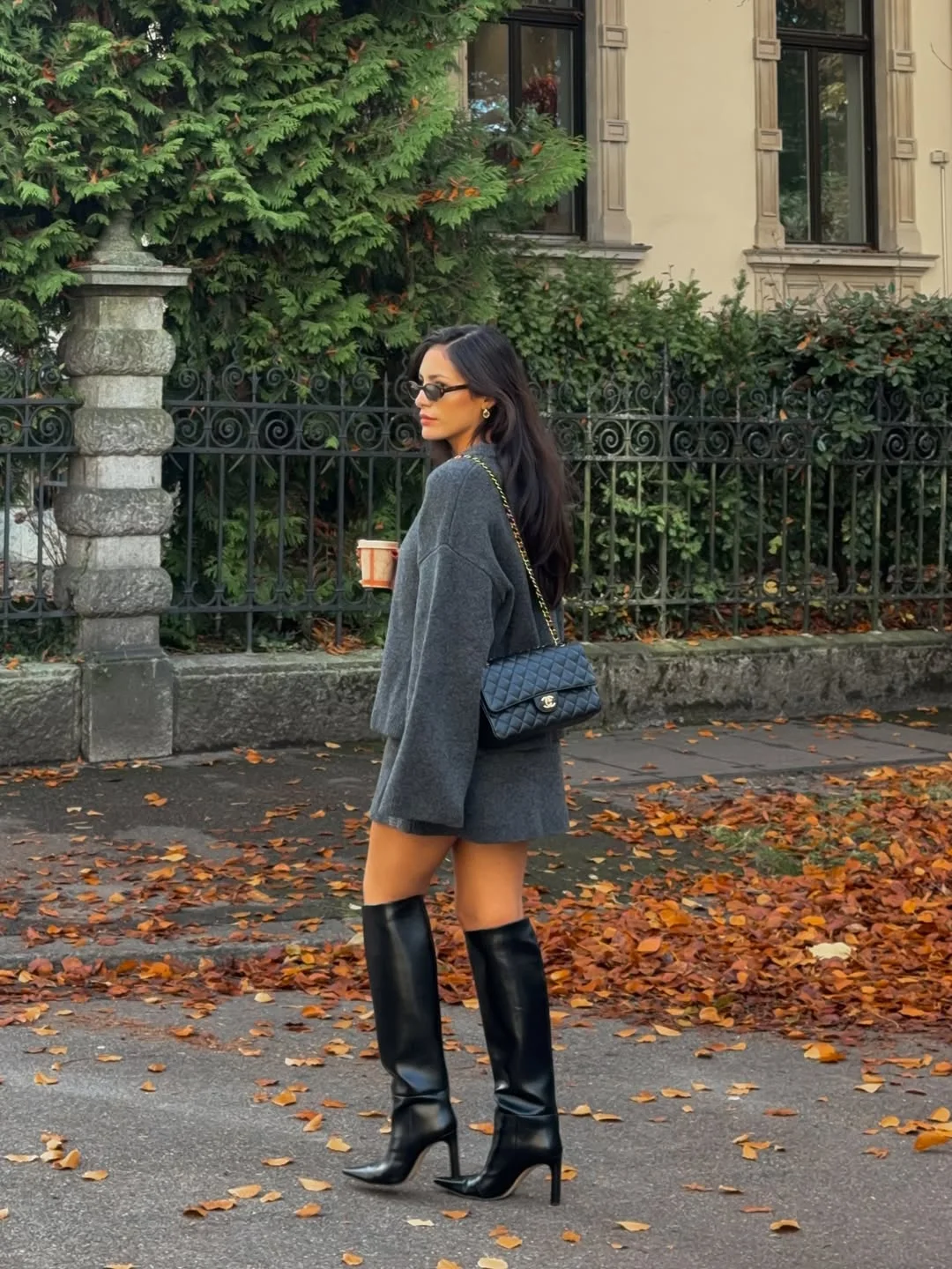 fall travel wardrobe for women 2026 Oversized Knitwear and Knee-High Boots for Peak Fall Style