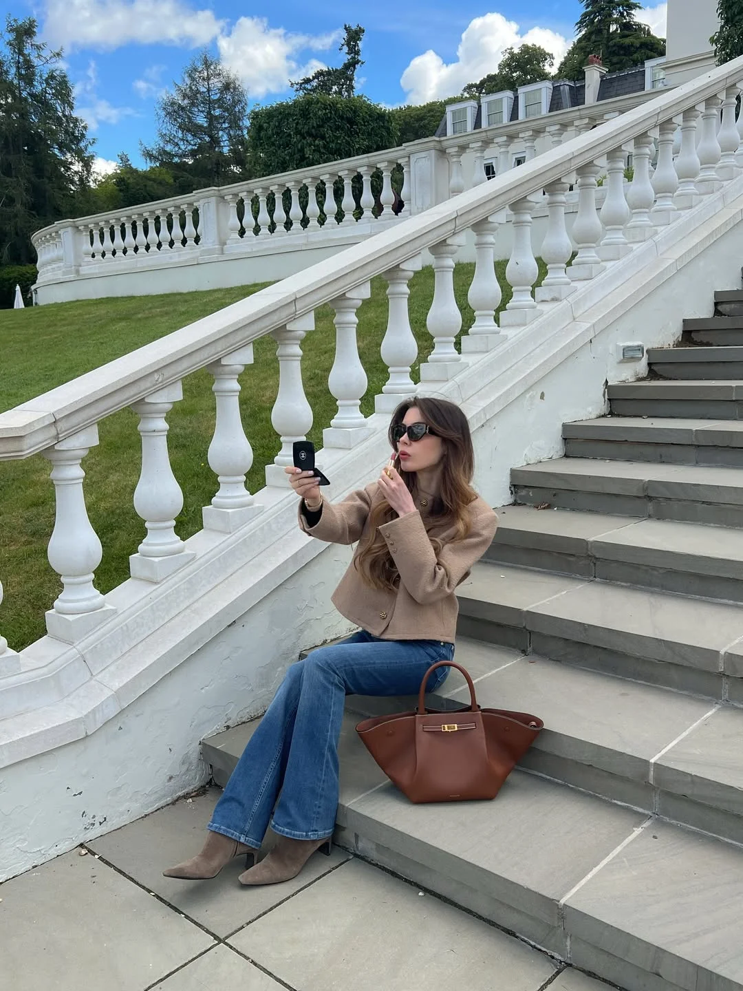 fall travel wardrobe for women 2026 Classic Denim and Camel Tones for Long Travel Days