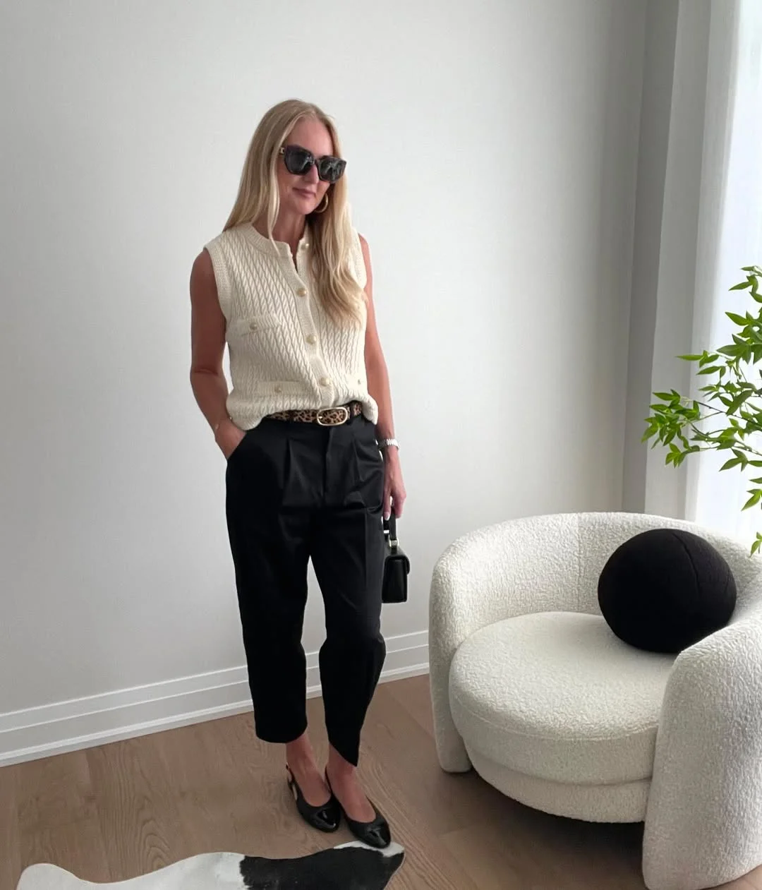 fall vest outfits for women 2026 The Sleeveless Cream Vest That Makes Black Trousers Look Instantly Softer
