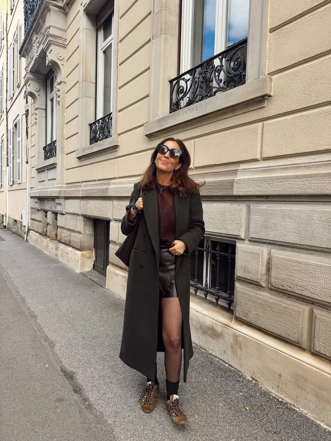 fall work outfits 2026 Long Coat Styling With A Leather Mini Skirt