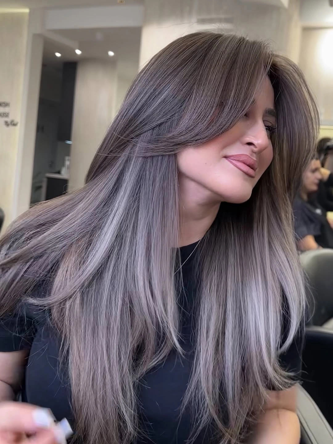 august hairstyles and color ideas 2026 Smoky Mushroom Blonde with Feathered Curtain Layers