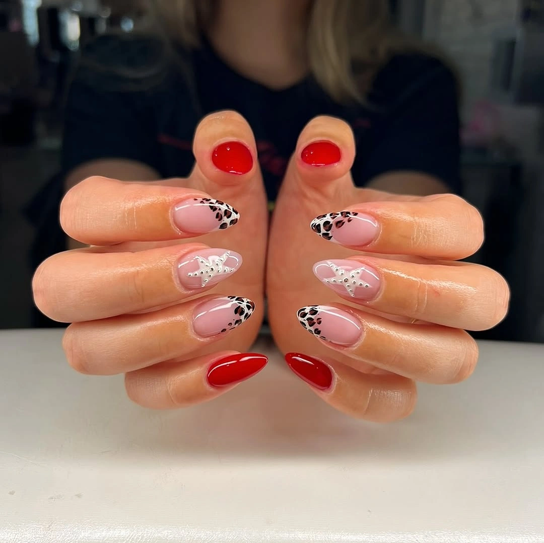 august nails ideas 2026 Bold Red and Animal Print Nails with Glamorous Details