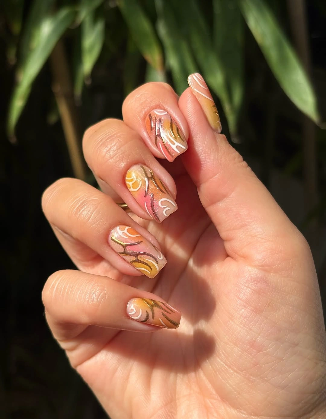 august nails ideas 2026 Abstract Sunset Swirls with Artistic Earthy Tones