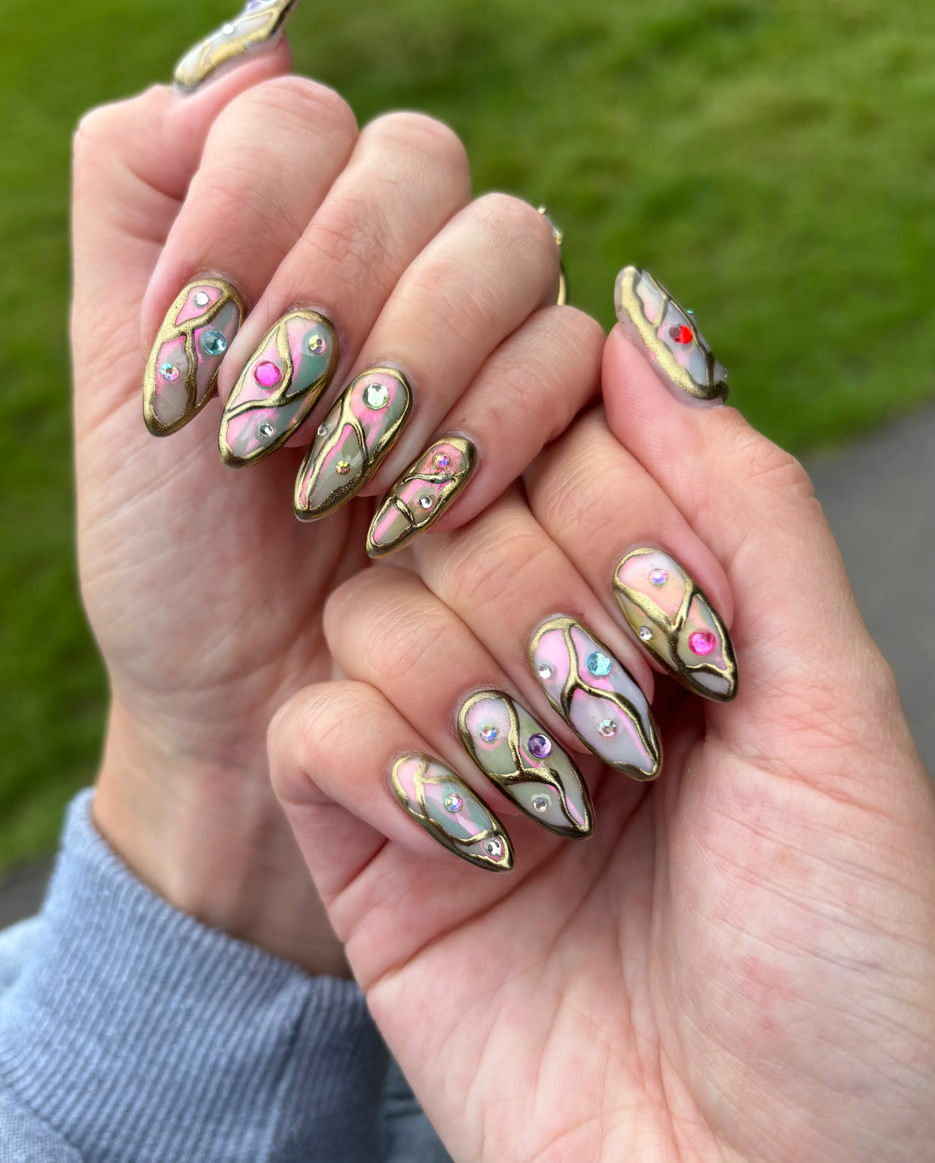 august nails ideas 2026 Jewel-Inspired Metallic Almond Nails