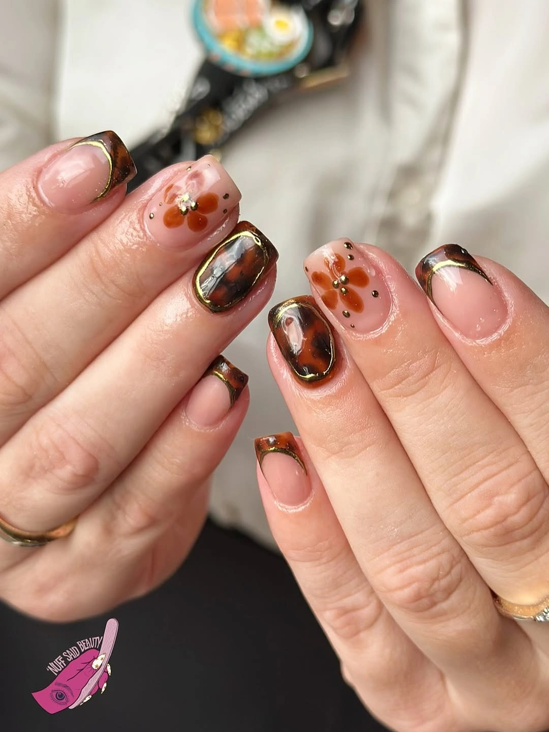 august nails ideas 2026 Elegant Tortoiseshell French Tips with Delicate Floral Accents