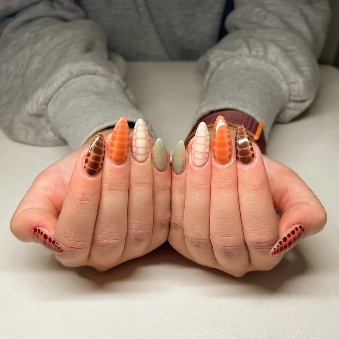 august nails ideas 2026 Textured Earth-Tone Almond Nails Inspired by Late Summer