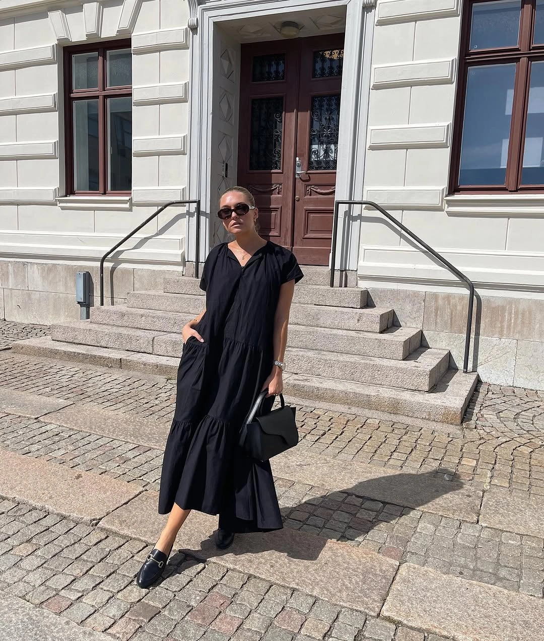 august outfits 2026 effortless black midi dress
