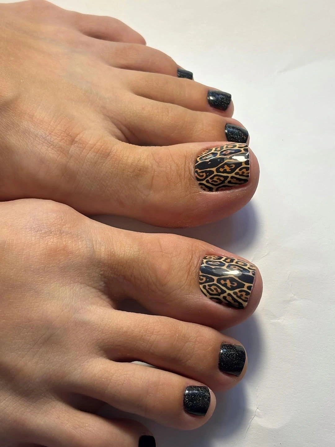 august pedicure nails ideas 2026 Bold Leopard Accent with Midnight Black Glamour