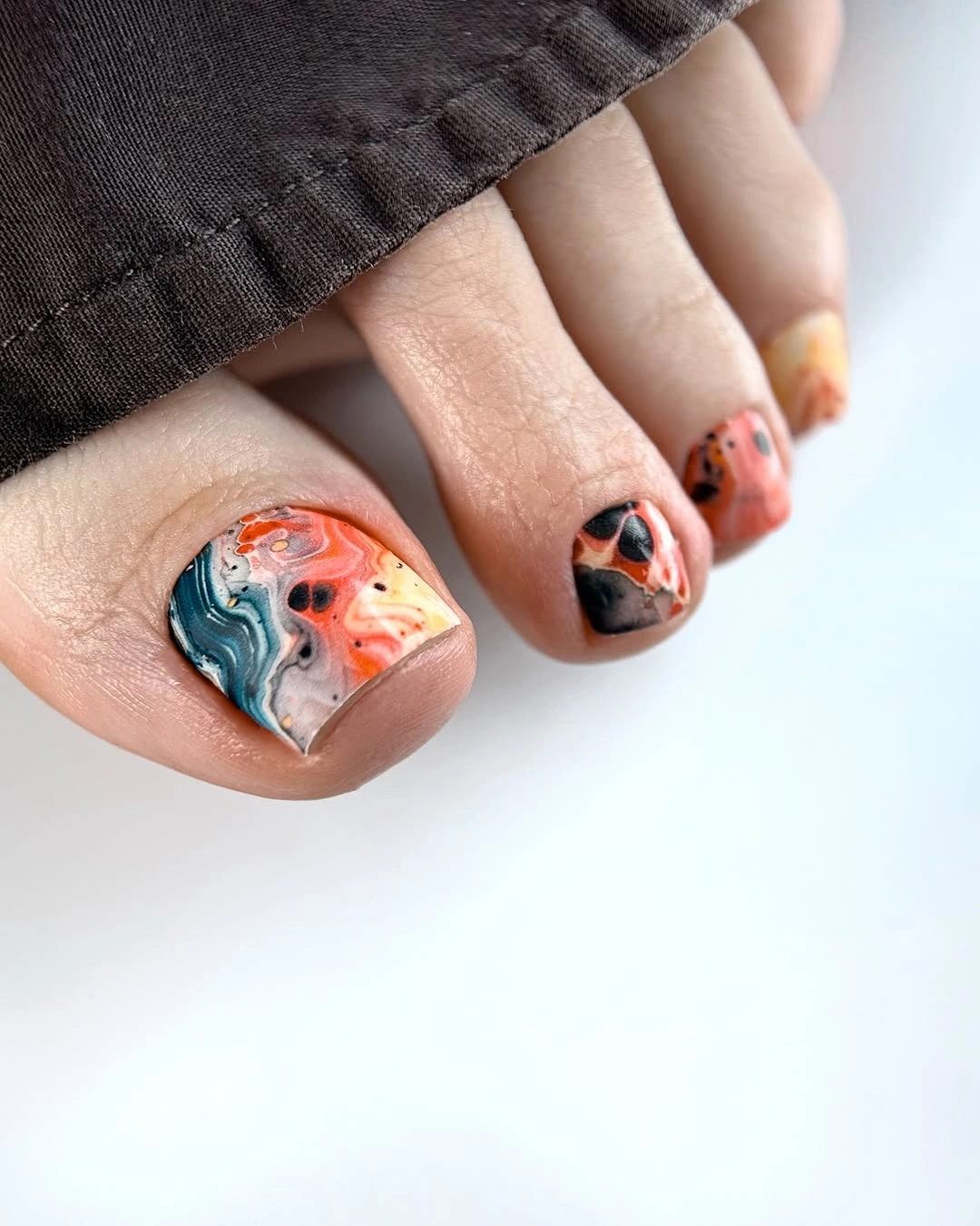 august pedicure nails ideas 2026 Abstract Marble Art with Sunset-Inspired Swirls