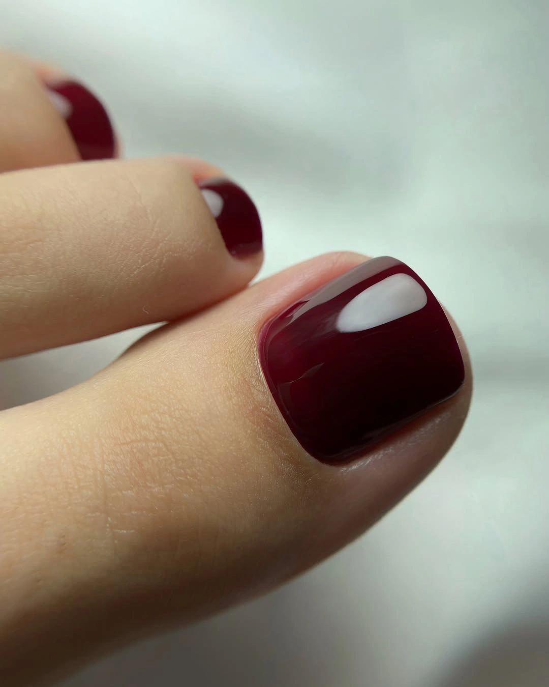 august toe nails 2026 Glossy Bordeaux for Sophisticated Evenings
