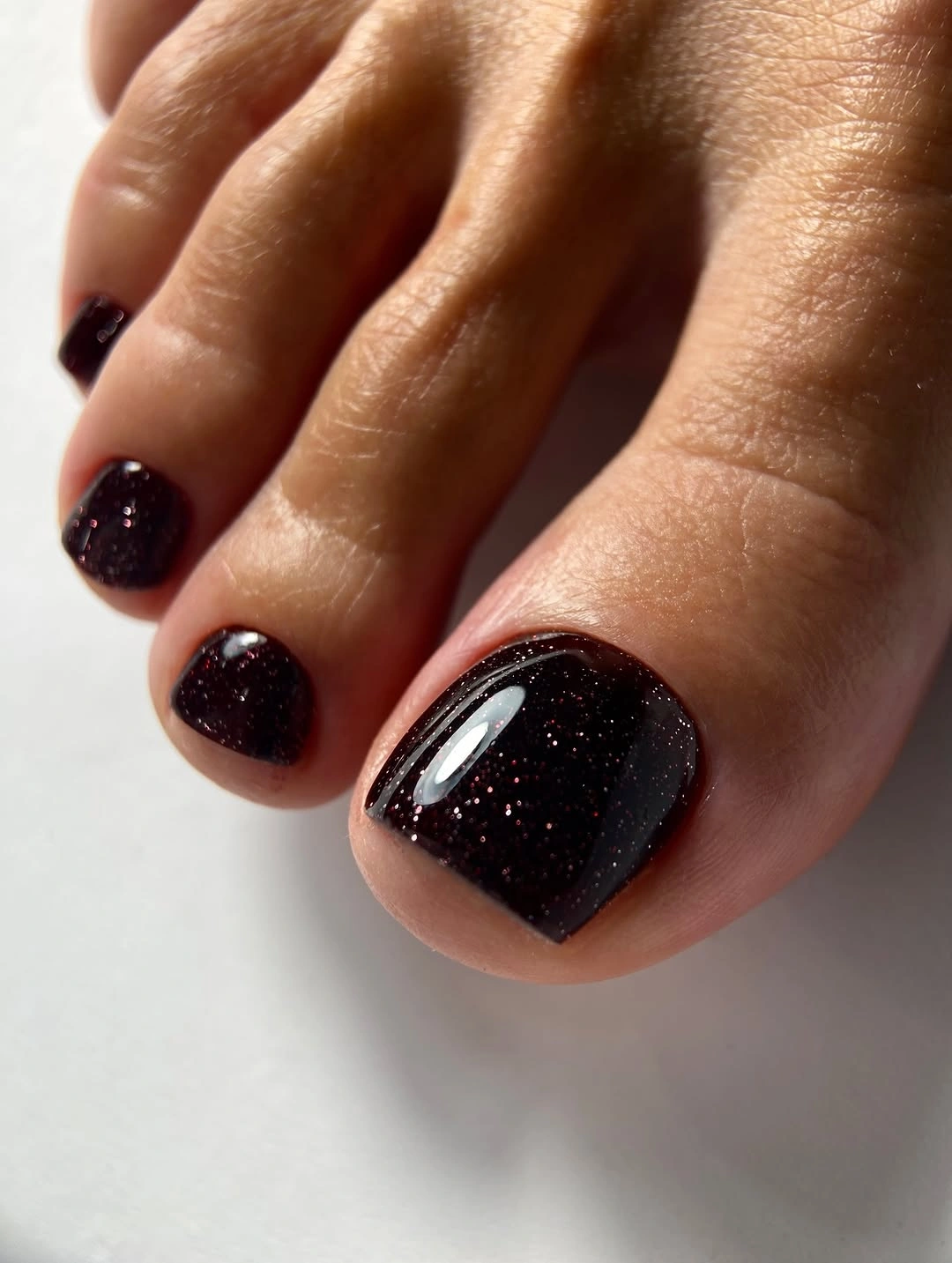 august toe nails 2026 Deep Burgundy Sparkle for Late Summer Evenings