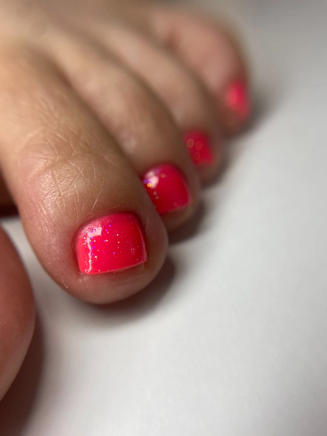 august toe nails 2026 Electric Watermelon Pink with a Hint of Sparkle