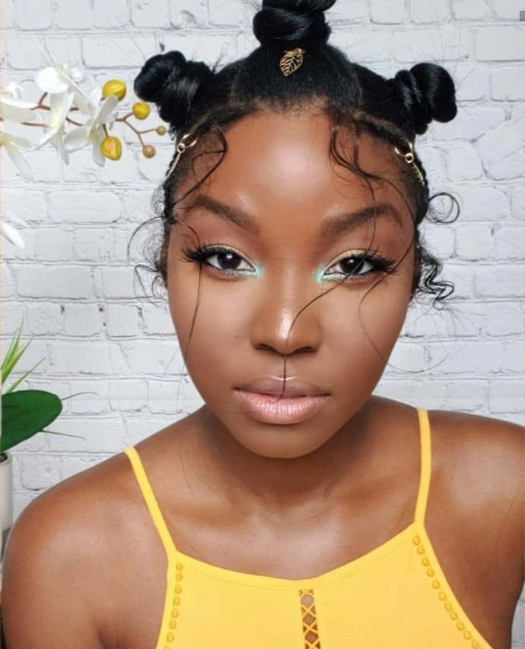 bantu knots hairstyles Playful High Bantu Knots with Soft Curved Tendrils