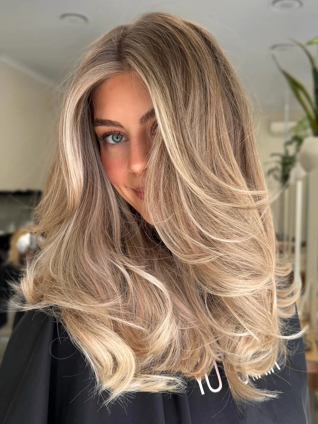beige blond hair color Voluminous Beige Blonde With Feathered Face-Framing Layers