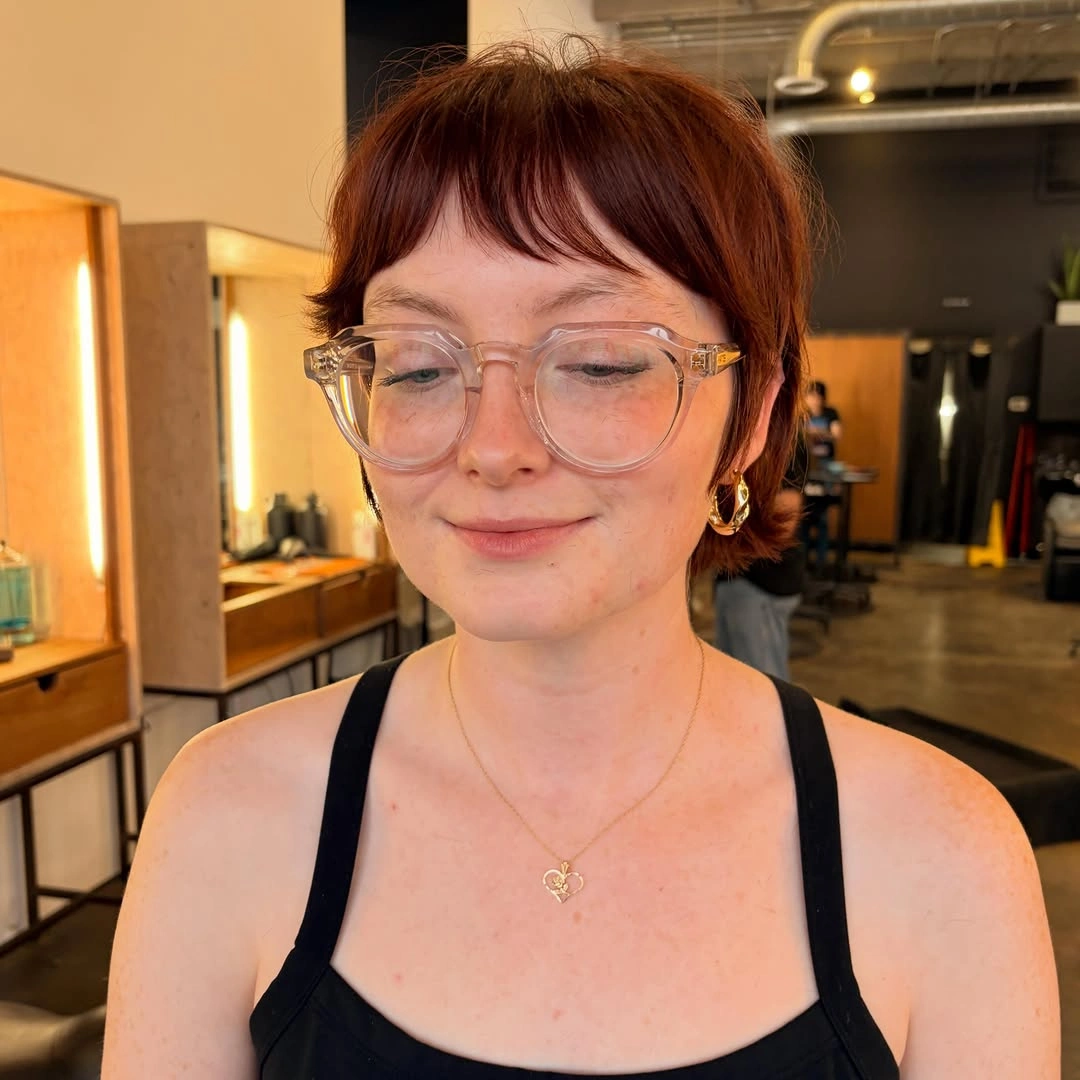 bixie haircut Soft Red Bixie With Baby Bangs And Glasses