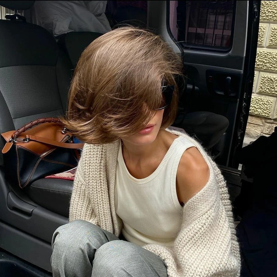 bobbed haircut for women Voluminous Retro Bob with Sweeping Curtain Movement