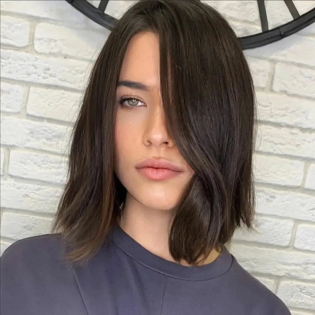 bobbed haircut for women Textured Italian-Inspired Midi Bob with Long Fringe