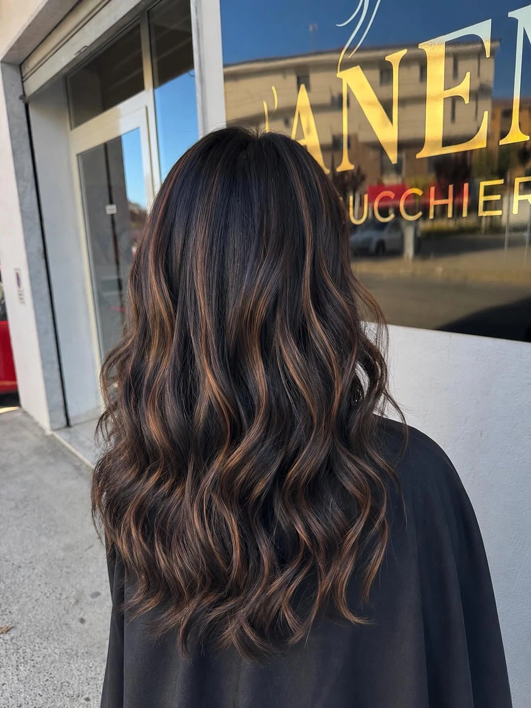 body waves hairstyle Espresso Waves With Delicate Caramel Ribbons