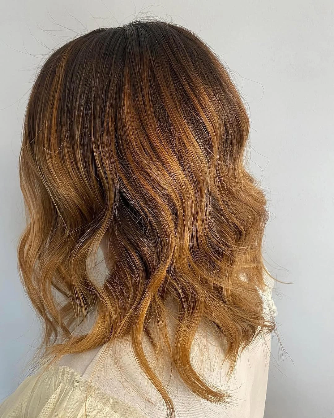 body waves hairstyle Soft Caramel Body Waves That Add Dimension to a Chic Bob
