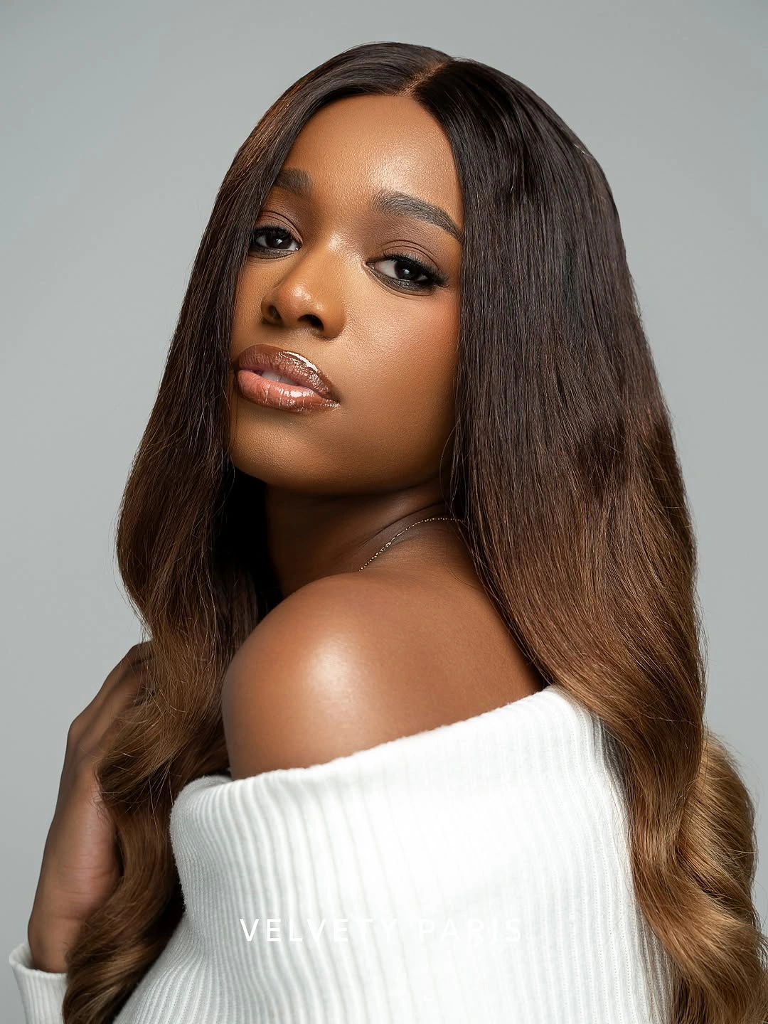 body waves hairstyle Sleek Ombre Waves With a Seamless Center Part