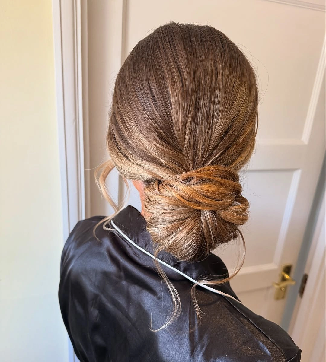 bridesmaid hairstyling Soft Twisted Low Chignon That Never Goes Out of Style