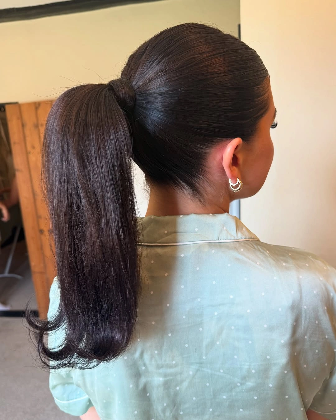 bridesmaid hairstyling Sleek High Ponytail for Modern Bridal Style