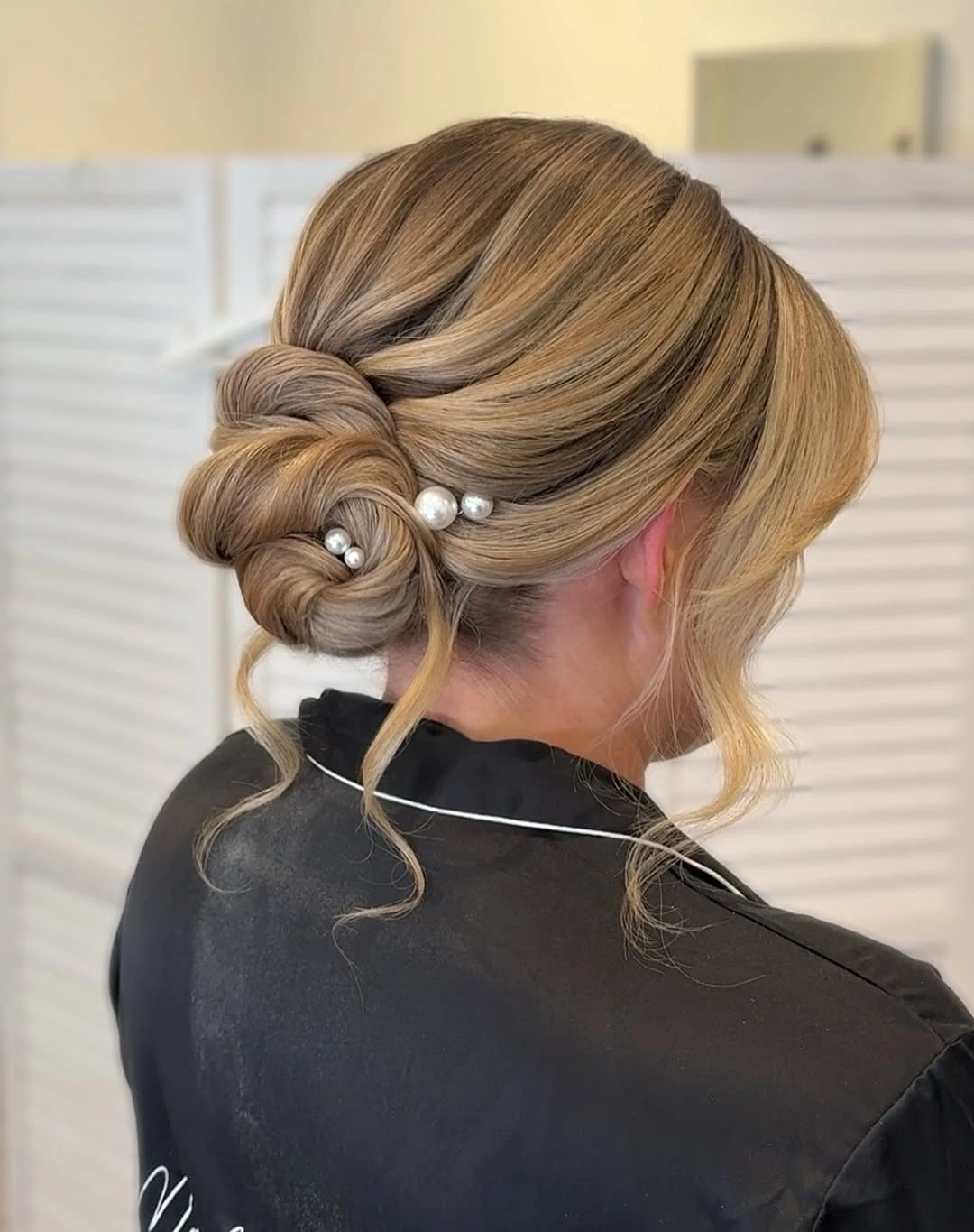 bridesmaid hairstyling Twisted Pearl Low Bun with Timeless Bridal Charm