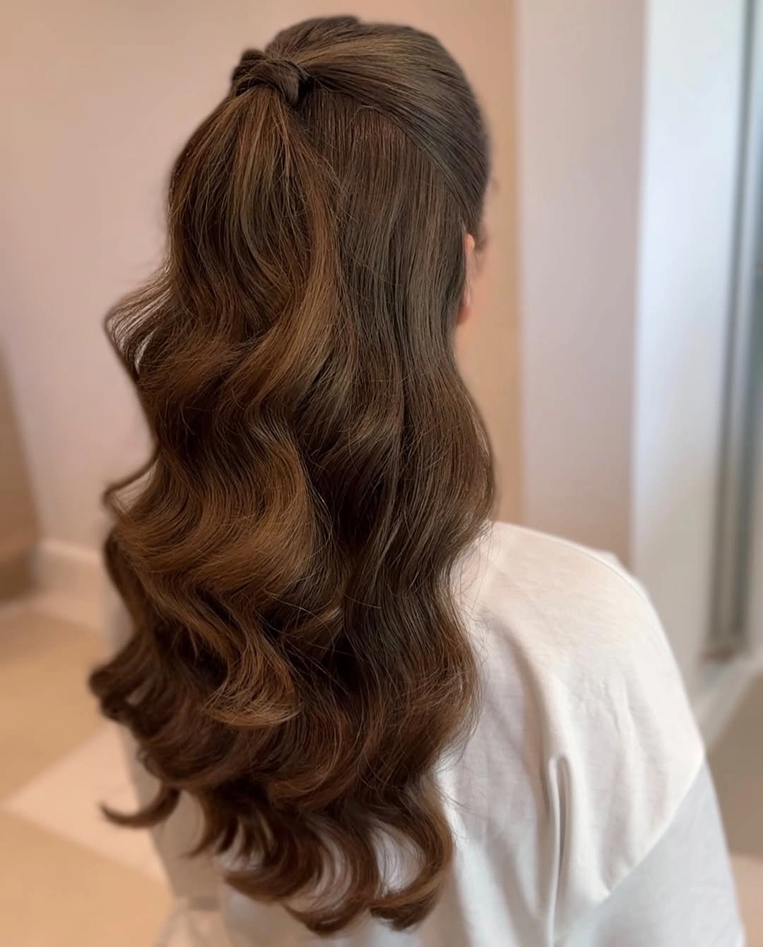 bridesmaid hairstyling Voluminous Half Ponytail with Soft Romantic Waves