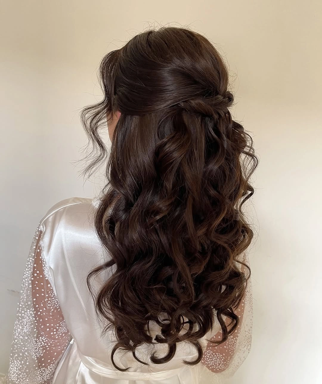 bridesmaid hairstyling Soft Romantic Curls with Delicate Twisted Details