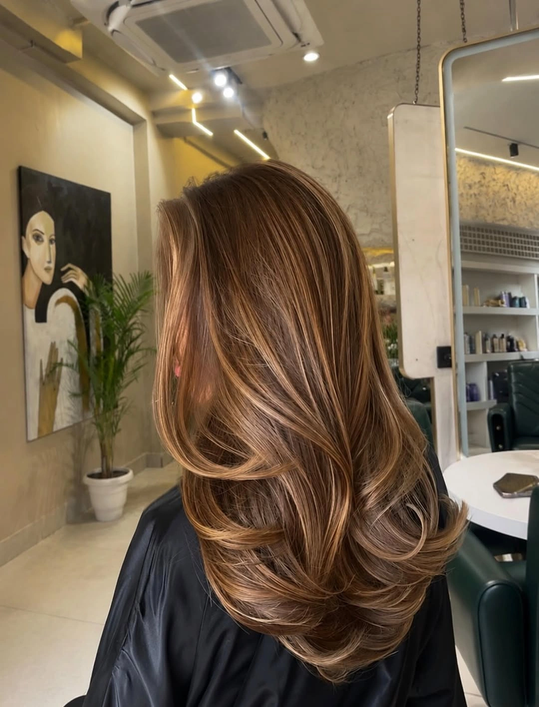 choppy medium layered hair Toasted Caramel Layers with a Sweeping Side Frame