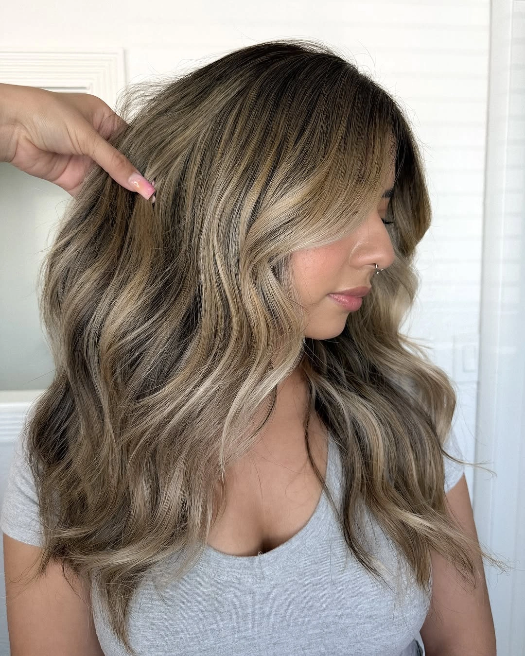 choppy medium layered hair Smoky Bronde Waves with Long Curtain Bangs