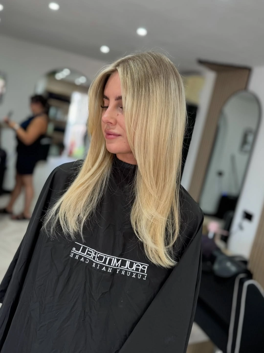 choppy medium layered hair Sleek Vanilla Blonde with Feathered Face-Framing Layers