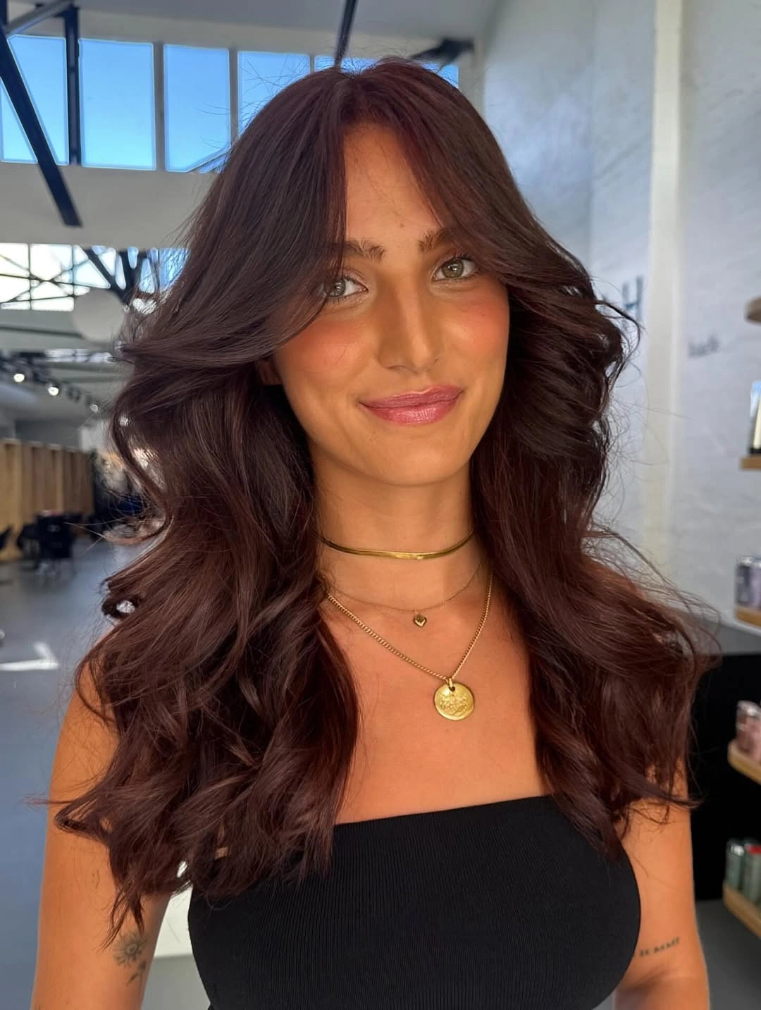 dimensional brunette hair color Rich Mocha Brunette with Curtain Bangs and Velvet Shine