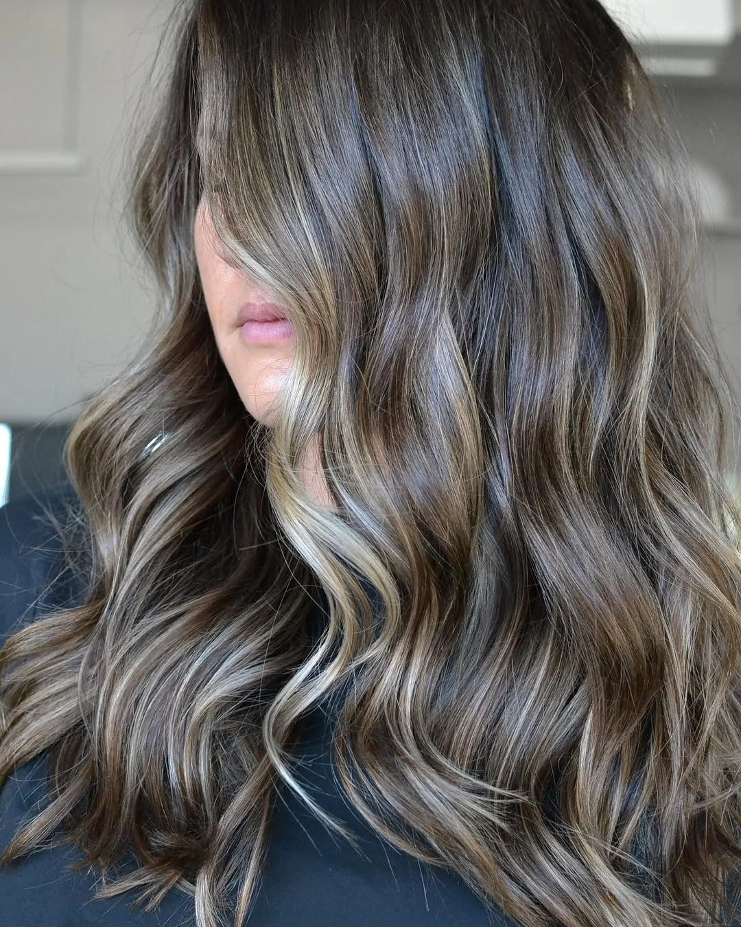 dirty blonde hair color Mocha Dirty Blonde Waves With Delicate Face-Framing Brightness
