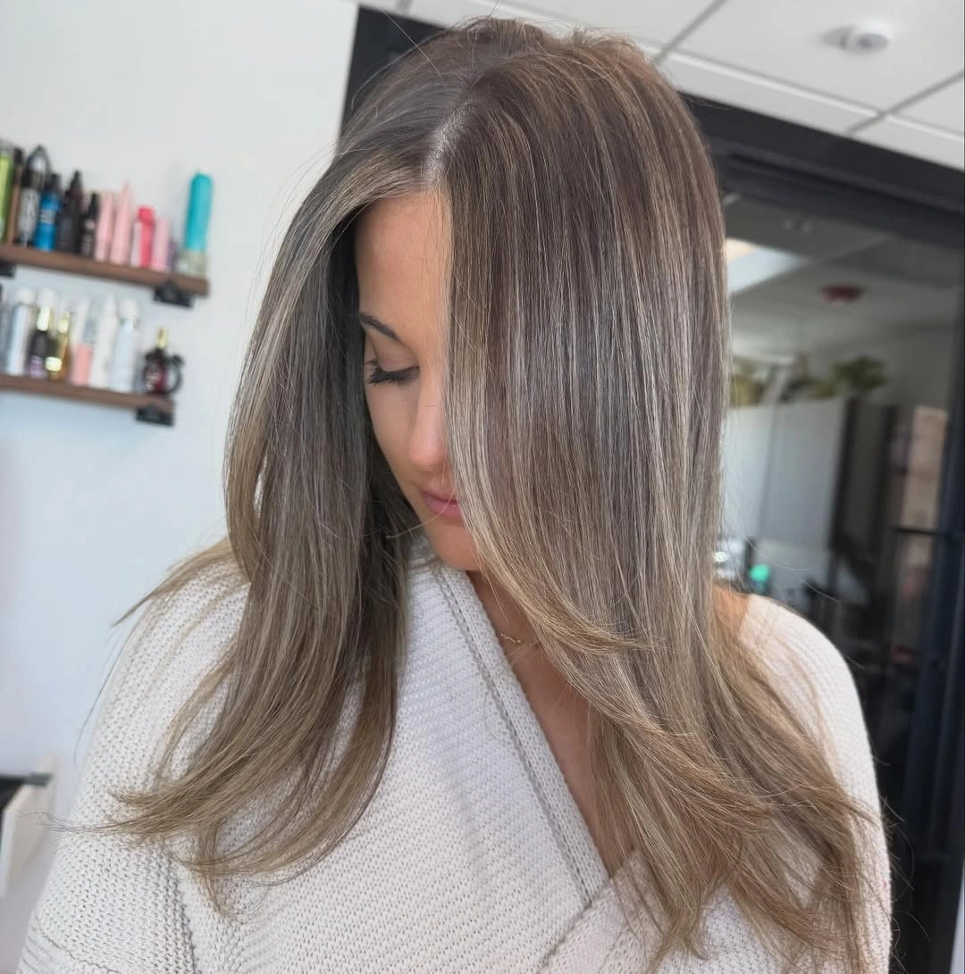 dirty blonde hair color Glossy Long Dirty Blonde With Seamless Face-Framing Brightness