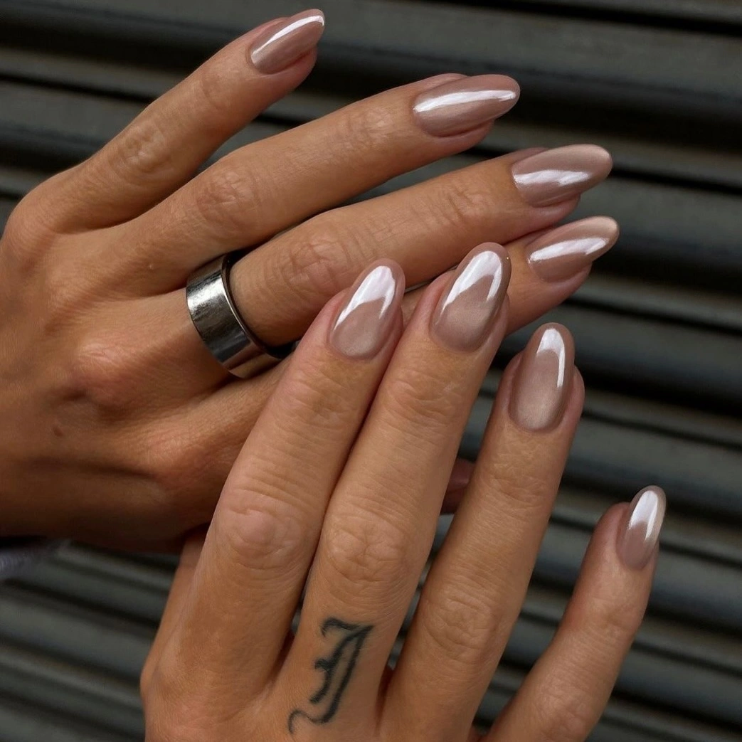 nude almond nails with pearl chrome ribbons