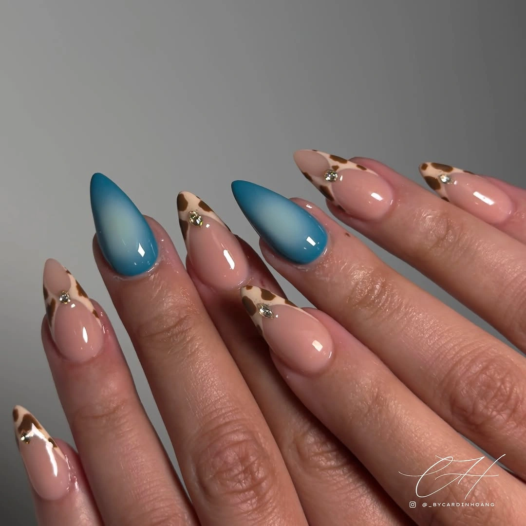 blue almond nails with leopard tipped accents
