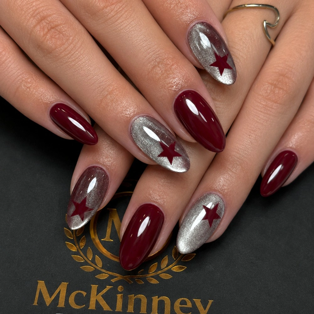 burgundy almond nails with silver mirror accents