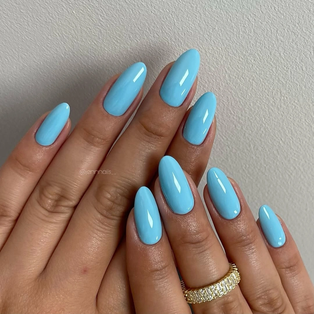 sky blue glossy almond nails
